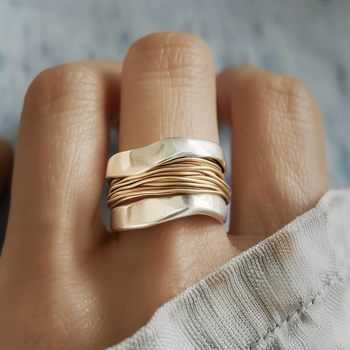 Silver ring with gold wire