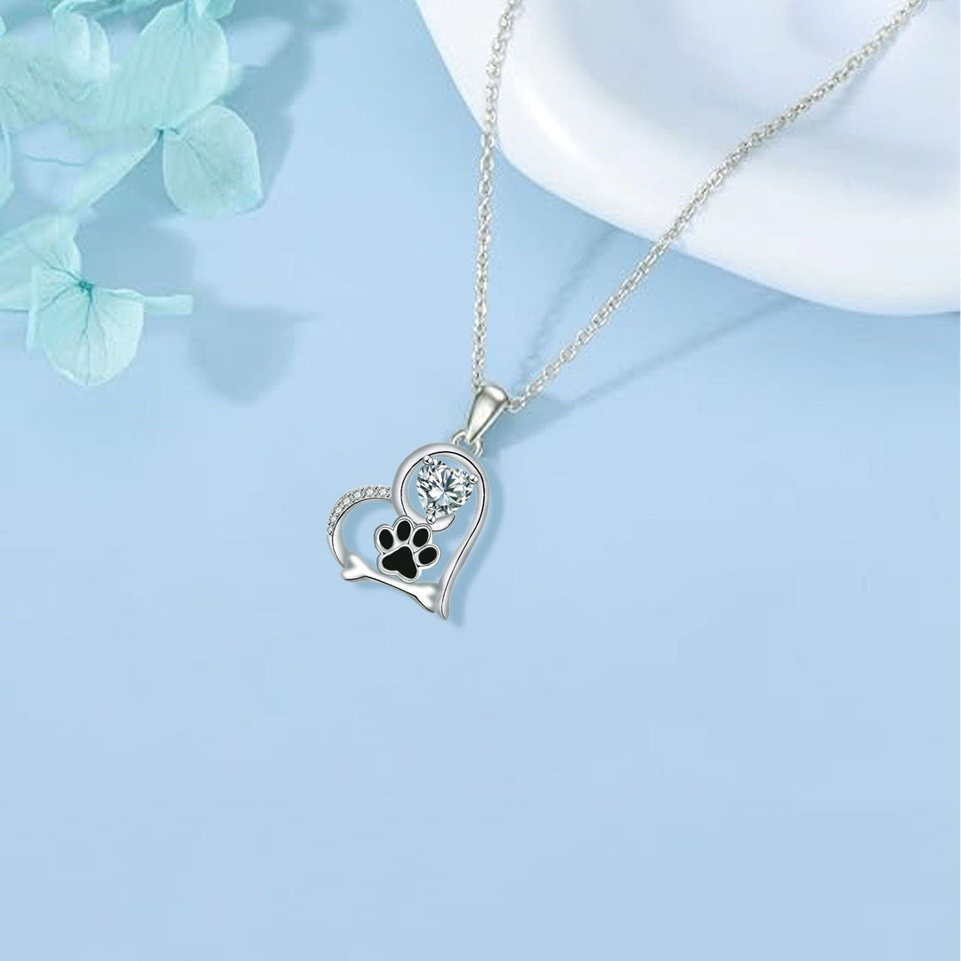 Handmade necklace with a dog paw print and a bone with zirconia