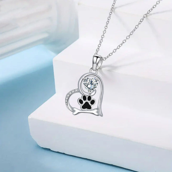Handmade necklace with dog paw print and bone with zirconia