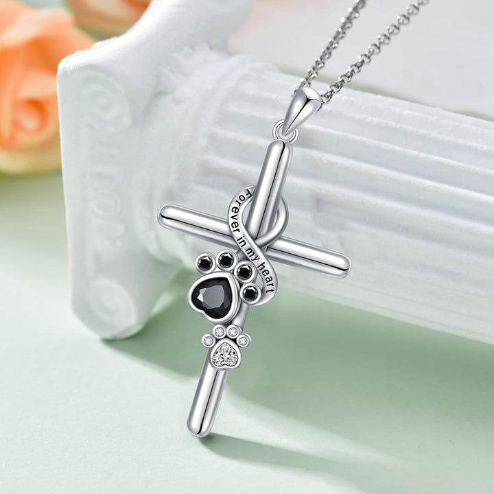 Silver paw and cross pendant necklace