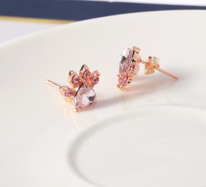 Rose gold jewelry set with paw motif