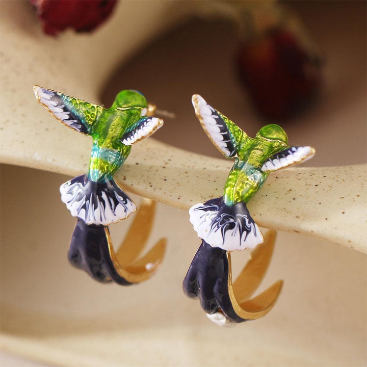 Unique creative earrings in the shape of a hummingbird
