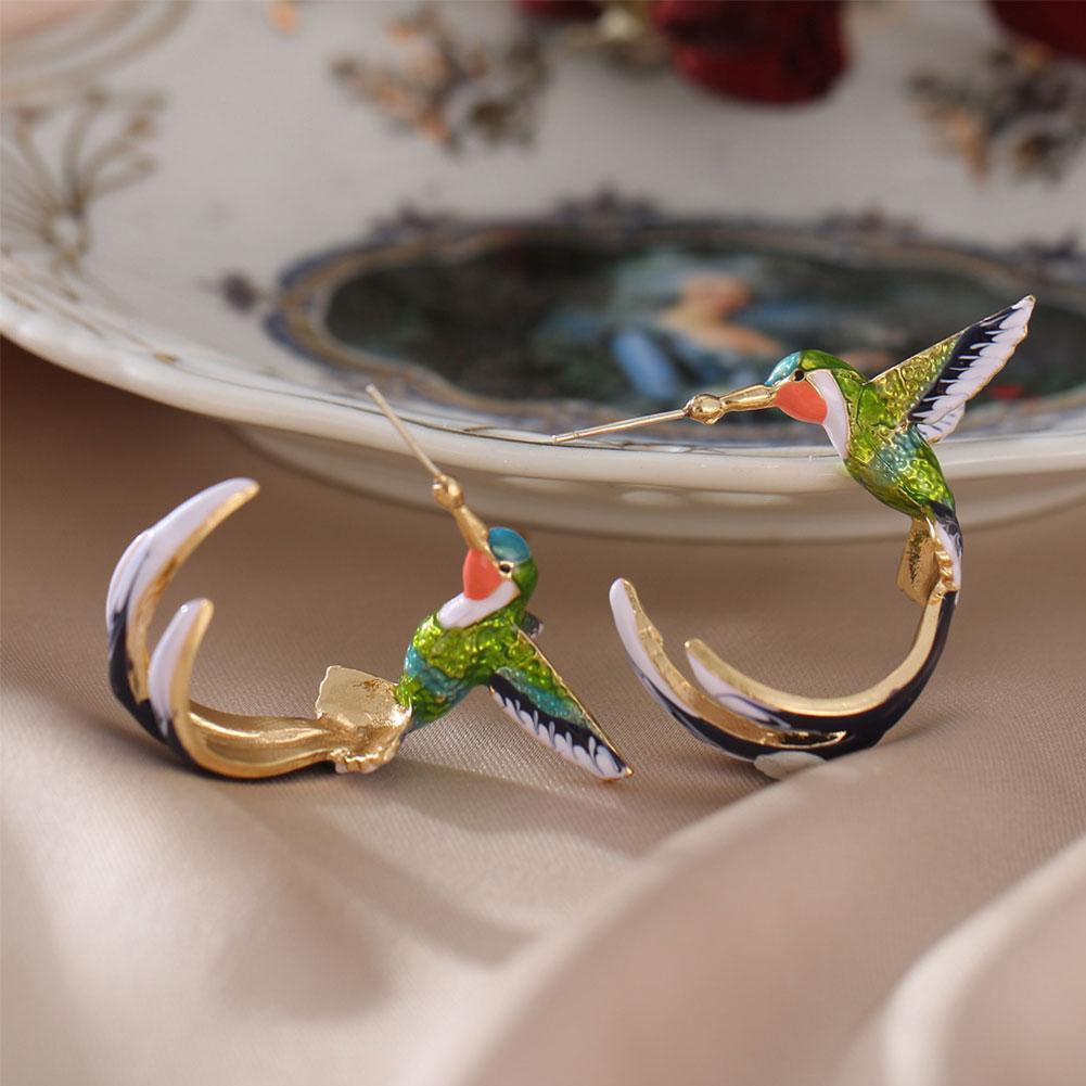 Unique creative earrings in the shape of a hummingbird
