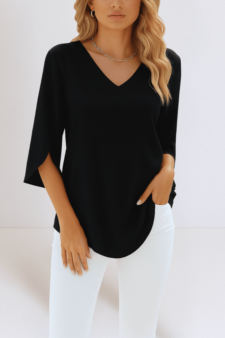 Elegant top with a V-shaped neckline and open sleeves