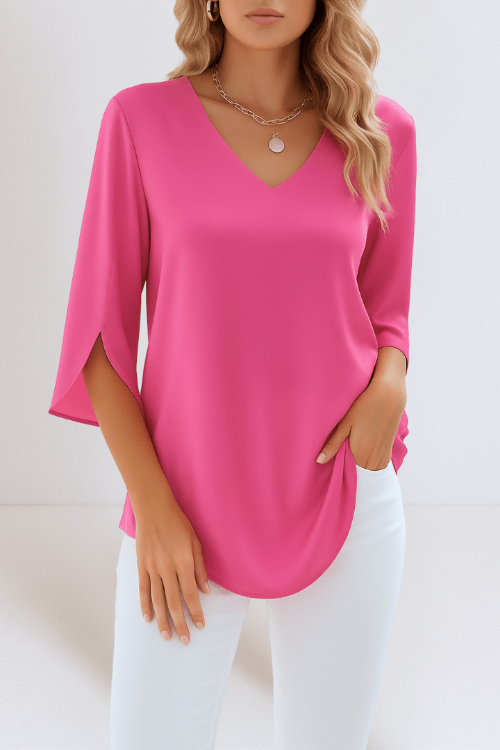 Elegant top with a V-shaped neckline and open sleeves