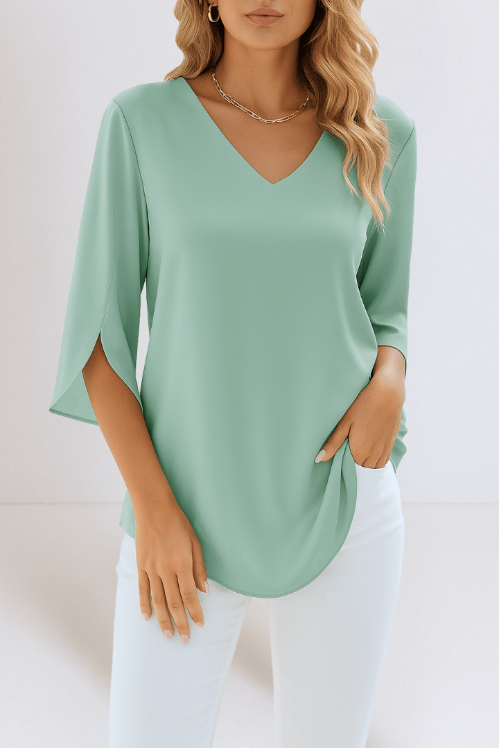 Elegant top with a V-shaped neckline and open sleeves