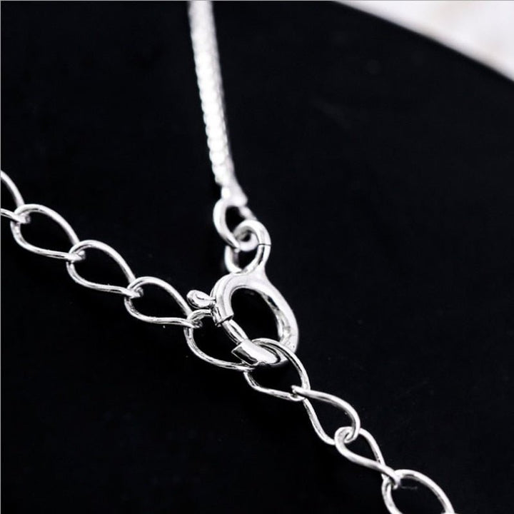 Elegant necklace with a crescent moon and a cat