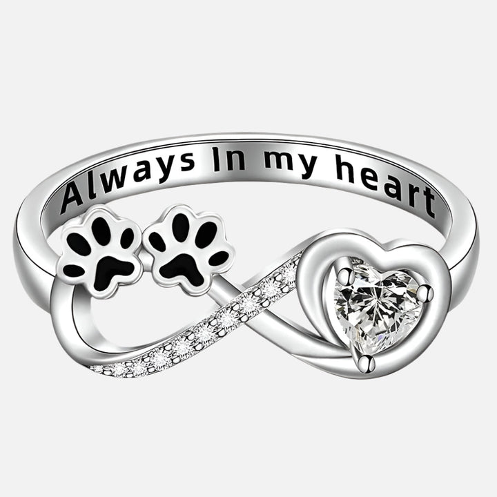 Ring with zirconias in the shape of a paw with a heart and the infinity symbol