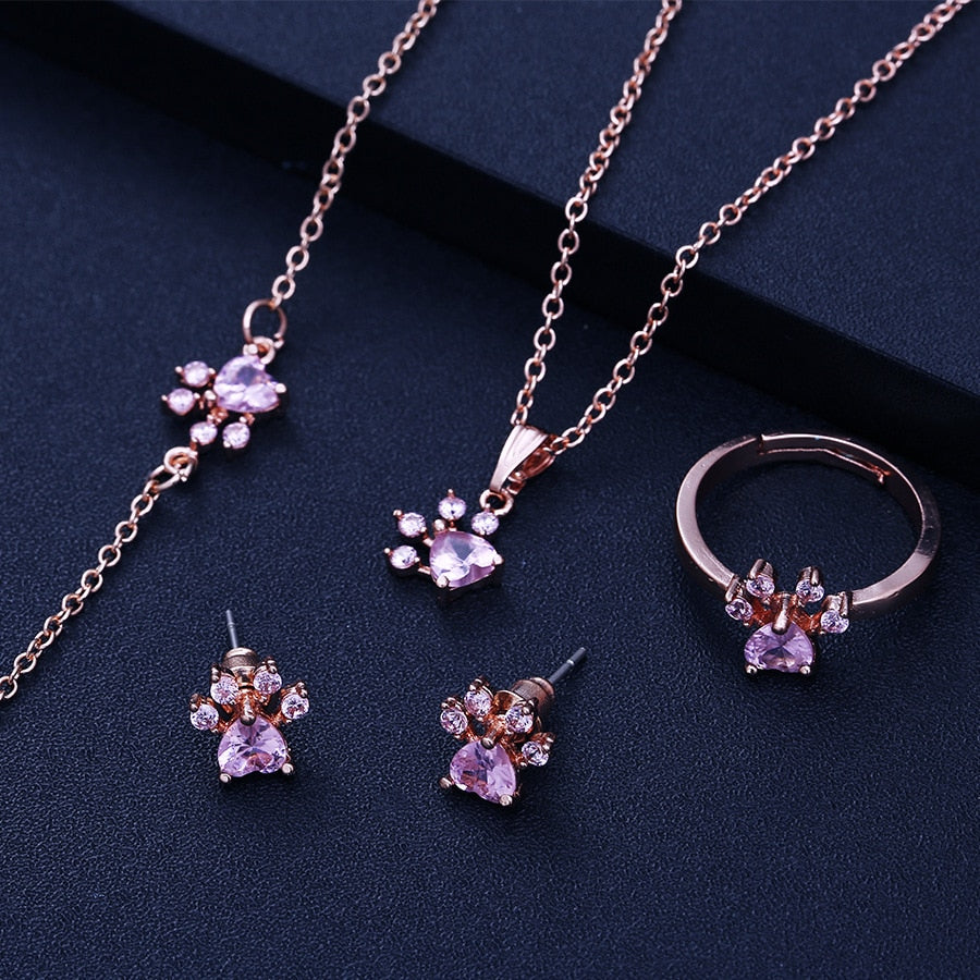 Rose gold jewelry set with paw motif