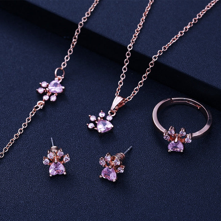 Rose gold jewelry set with paw motif